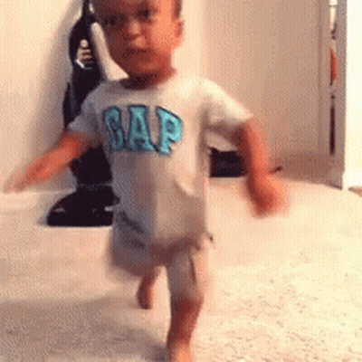 Little Boy In Gap Shirt Running On Carpet GIF