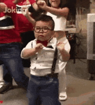 Little Boy In Glasses And Tie Dancing GIF