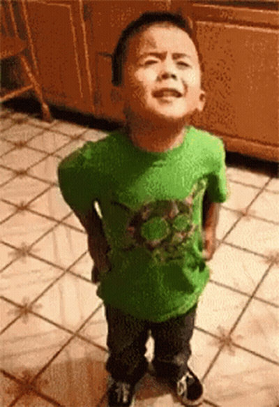 Little Boy In Green Shirt Hands On Hips GIF
