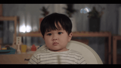 Little Boy In High Chair With Letter B GIF