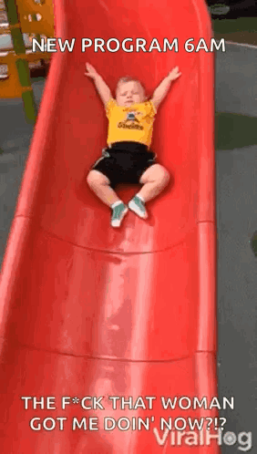 Little Boy Laying On Red Slide New Program 6 AM GIF