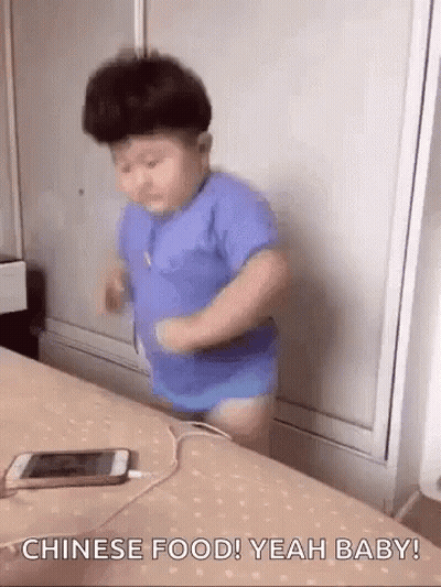 Little Boy On Bed With Plugged Cell Phone GIF