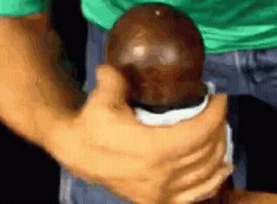Little Boy Playing With Logs In Grass GIF