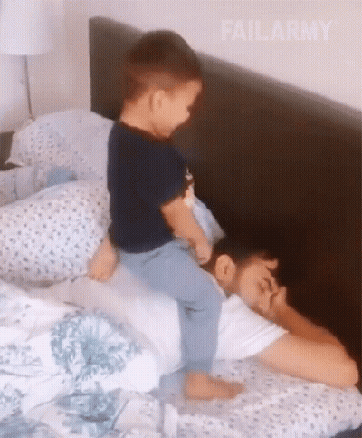 Little Boy Riding On Sleeping Man GIF