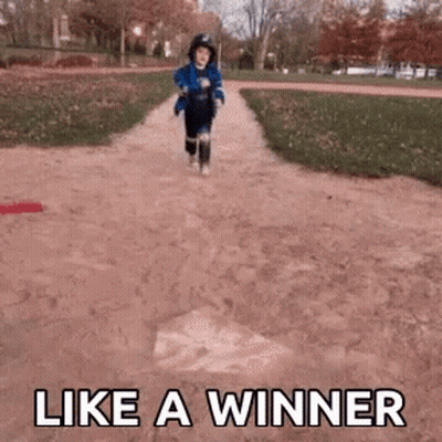 Little Boy Running Down Dirt Path Like A Winner GIF