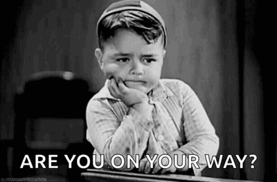Little Boy Sitting At Desk Asking Are You On Your Way? GIF