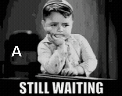 Little Boy Sitting At Desk Waiting GIF