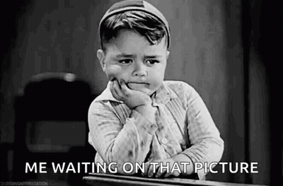 Little Boy Sitting At Desk Waiting GIF