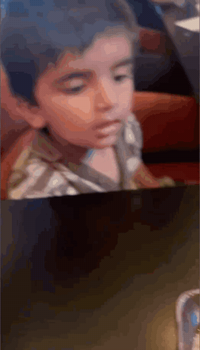 Little Boy Sitting At Table GIF