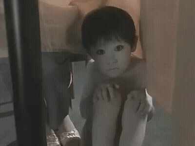 Little Boy Sitting Cross-Legged GIF