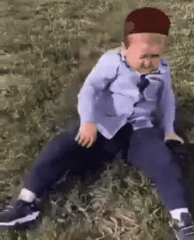 Little Boy Sitting In Blue Shirt And Hat GIF