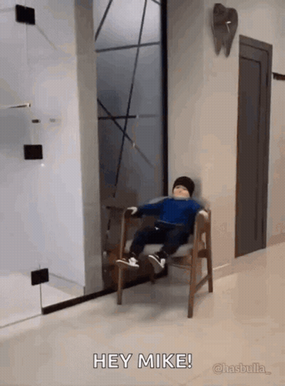 Little Boy Sitting In Waiting Room Saying Hey Mike GIF