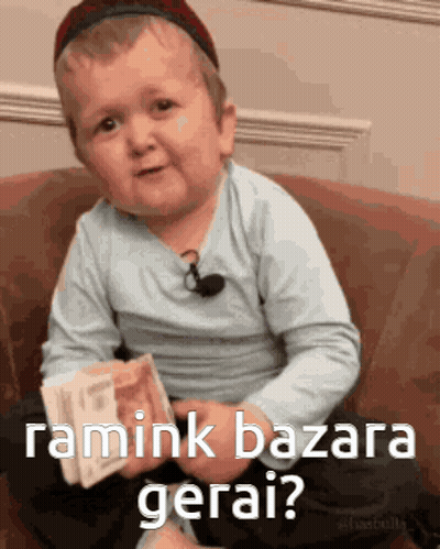 Little Boy Sitting On Couch Holding Money Asking Ramink Bazara Gerai GIF