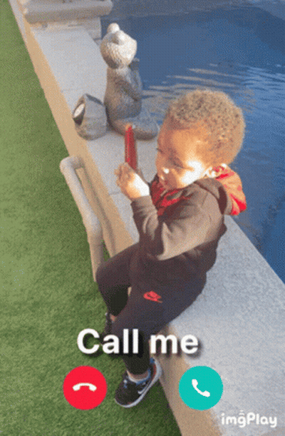 Little Boy Sitting On Wall Saying Call Me GIF