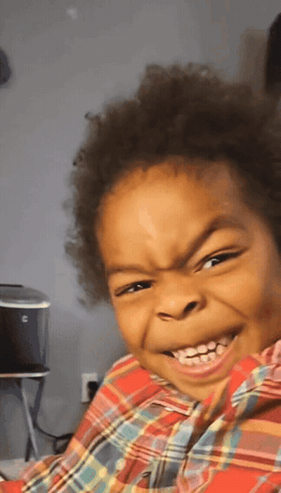 Little Boy Smiling In Plaid Shirt GIF