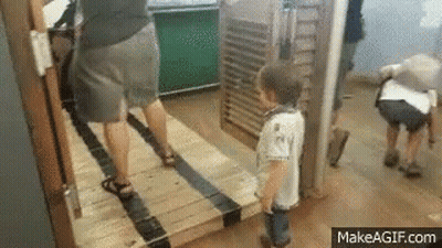 Little Boy Standing Next To Woman And Man GIF