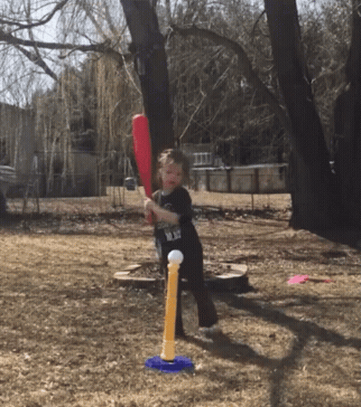 Little Boy Swinging Bat At Toy Ball GIF