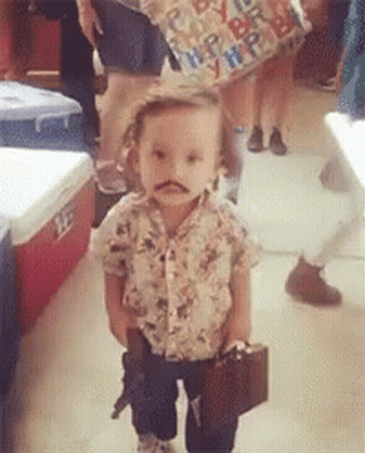 Little Boy With Fake Mustache Holding Suitcase And Gun GIF