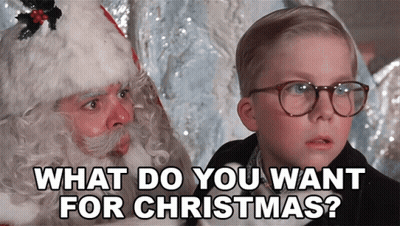 Little Boy With Glasses Talking To Santa Claus Saying What Do You Want For Christmas GIF