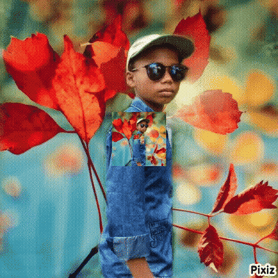 Little Boy With Sunglasses and Hat Among Leaves