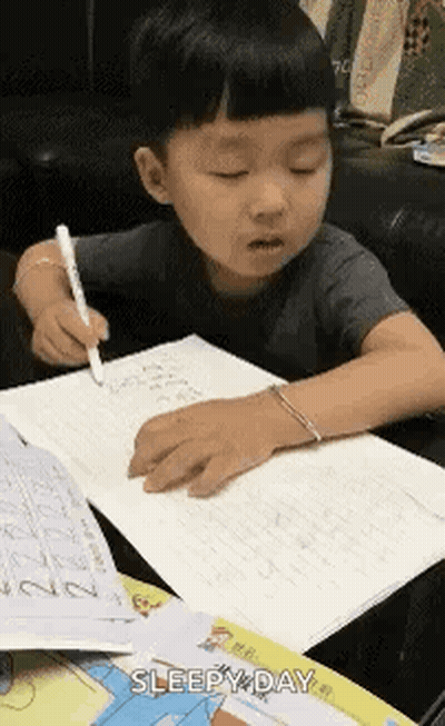 Little Boy Writing In Notebook GIF