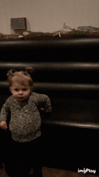 Little Girl At Black Staircase With Imgplay Sign GIF