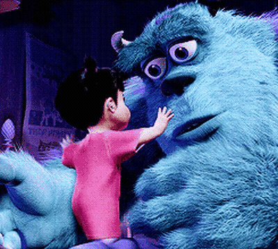 Little Girl Beside Monsters Inc Stuffed Monster GIF