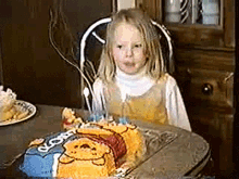 Little Girl Blowing Birthday Candles And Smoke