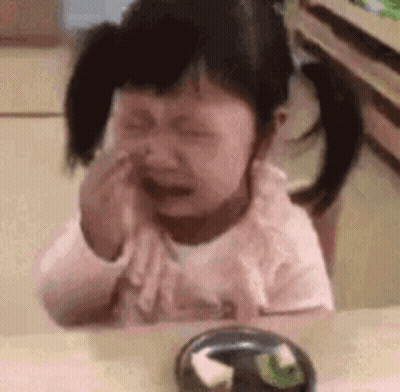 Little Girl Crying At Table With Food GIF