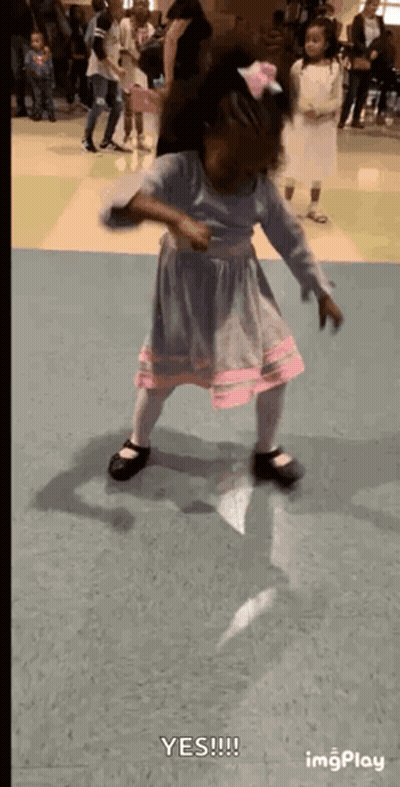 Little Girl Dancing In Blue And Pink Dress GIF