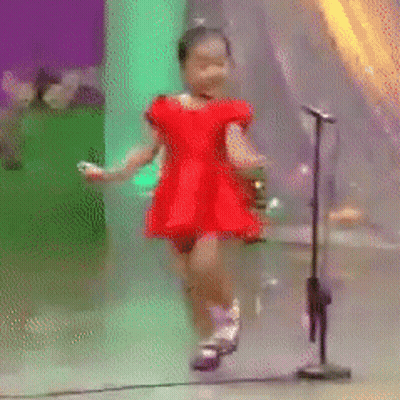 Little Girl Dancing In Front Of Microphone GIF