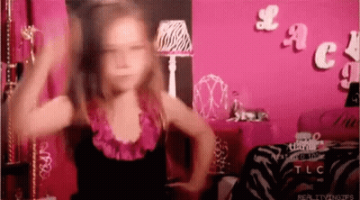Little Girl Dancing In Front Of Pink Lace Wall GIF