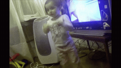 Little Girl Dancing In Front Of Windows Laptop GIF