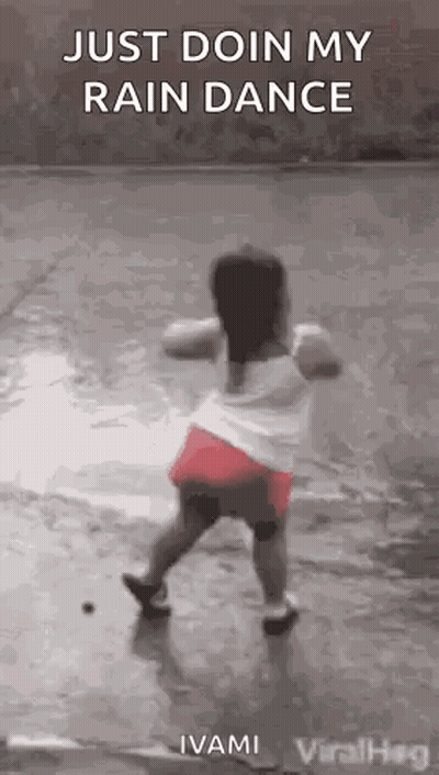 Little Girl Dancing In The Rain GIF
