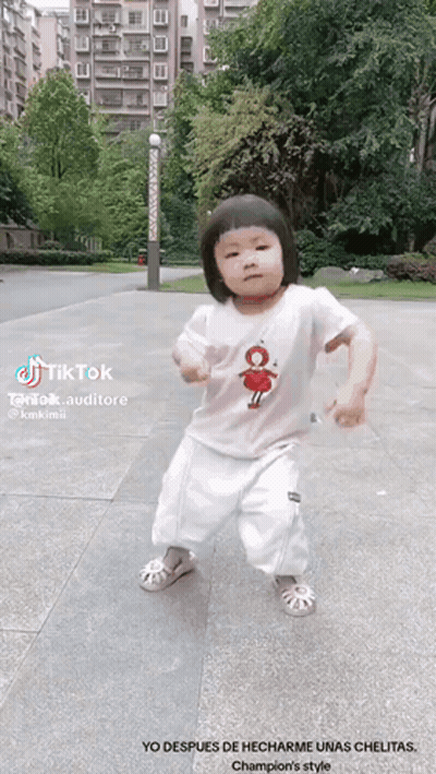 Little Girl Dancing On Sidewalk With TikTok Logo GIF