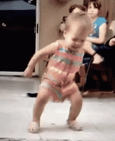 Little Girl Dancing While People Watch GIF