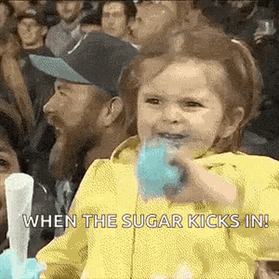 Little Girl Eating Blue Cotton Candy In Crowd GIF