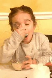 Little Girl Enjoying Delicious Food GIF