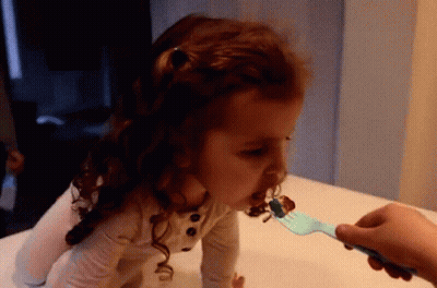 Little Girl Fed By Fork GIF