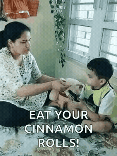 Little Girl Feeding Boy Pizza Slice GIF