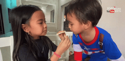 Little Girl Feeding Little Boy Slice Of Pizza GIF