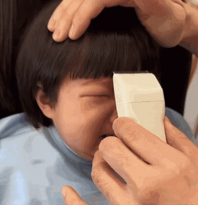 Little Girl Getting Hair Cut By Man GIF