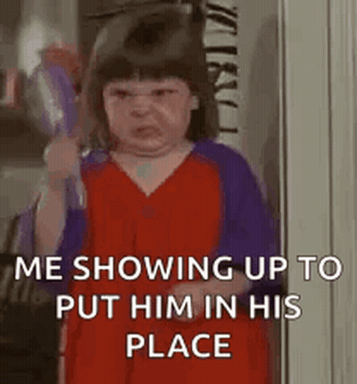 Little Girl Holding Broom Making Face GIF
