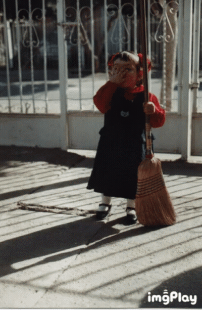 Little Girl Holding Broom GIF