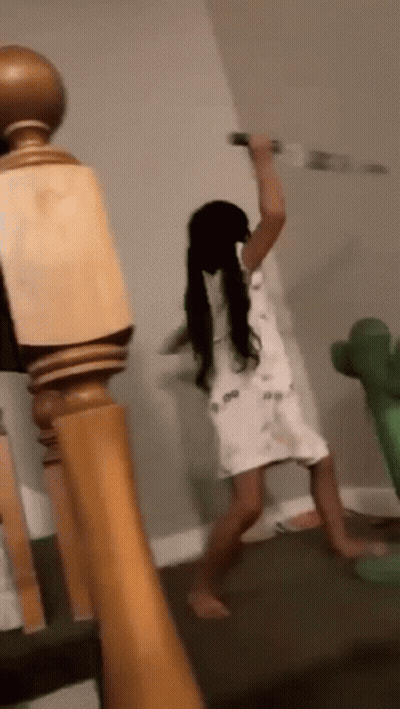 Little Girl Holding Knife on Staircase