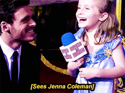 Little Girl Holding Microphone Talking To Man In Suit And Tie GIF