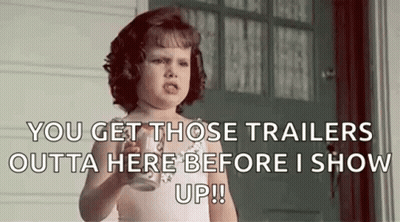 Little Girl Holding Milk Making Funny Face At Door GIF