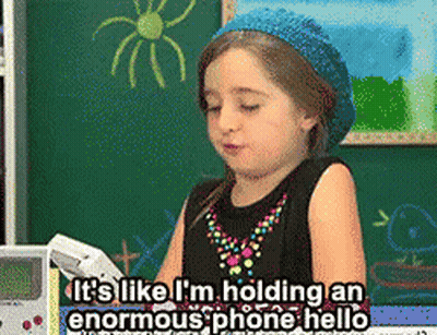 Little Girl Holding Phone Says It's Enormous GIF