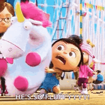 Little Girl Holding Stuffed Unicorn at Carnival