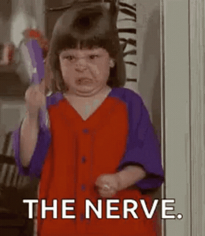 Little Girl Holding Toothbrush Making Face GIF